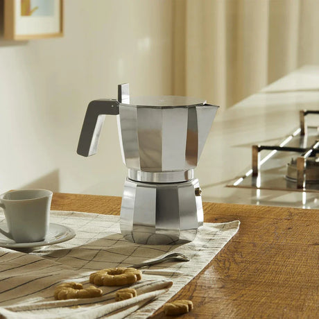 A stovetop coffee maker on a stove I Redber Coffee