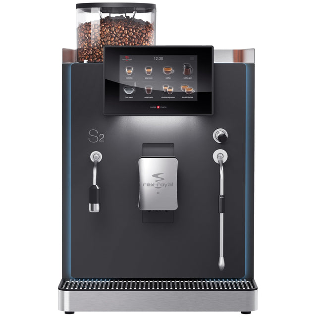 Rex-Royal S2 bean-to-cup coffee machine, designed for cafés, restaurants, and offices. Compact and Swiss-engineered, it features a 7-inch touchscreen, advanced milk system, and automated cleaning. Customisable with payment solutions and cup dispensers, delivering barista-quality coffee efficiently in high-demand environments.