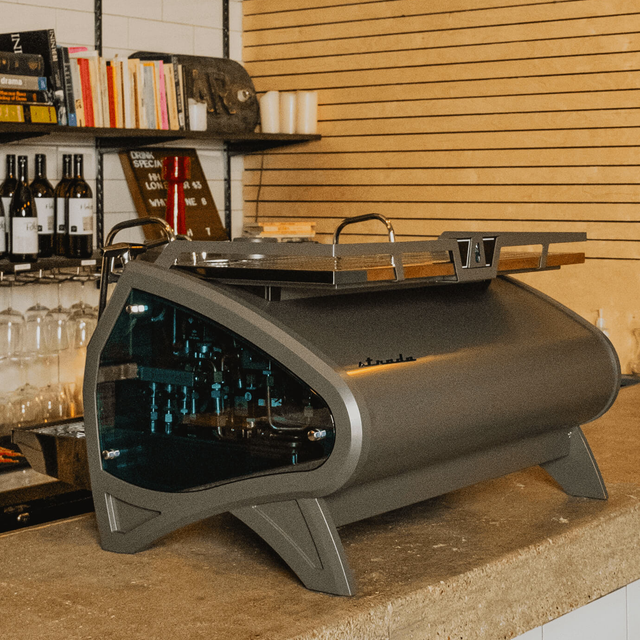 Side view of the La Marzocco Strada X espresso machine with dual boilers, real-time digital display, and pressure profiling, designed for specialty coffee brewing in high-demand cafés