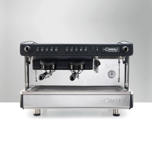 La Cimbali M26 SE espresso machine, ideal for cafés and restaurants. Features Italian craftsmanship, ThermoDrive Technology for consistent temperature control, and energy-saving mode. Available in sleek black and white finishes for reliable, barista-quality coffee service.