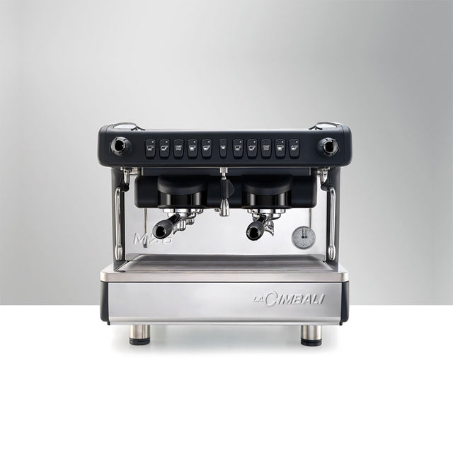 La Cimbali M26 SE espresso machine, ideal for cafés and restaurants. Features Italian craftsmanship, ThermoDrive Technology for consistent temperature control, and energy-saving mode. Available in sleek black and white finishes for reliable, barista-quality coffee service.