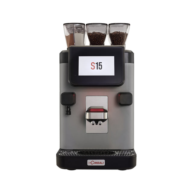 Compact La Cimbali S15 bean-to-cup coffee machine, designed for offices, hotels, and small businesses. Features include a 7-inch touchscreen, Turbo Milk system for quality milk foam, and remote monitoring via telemetry. Ideal for delivering up to 150 cups per day with consistent, Italian-style espresso quality.